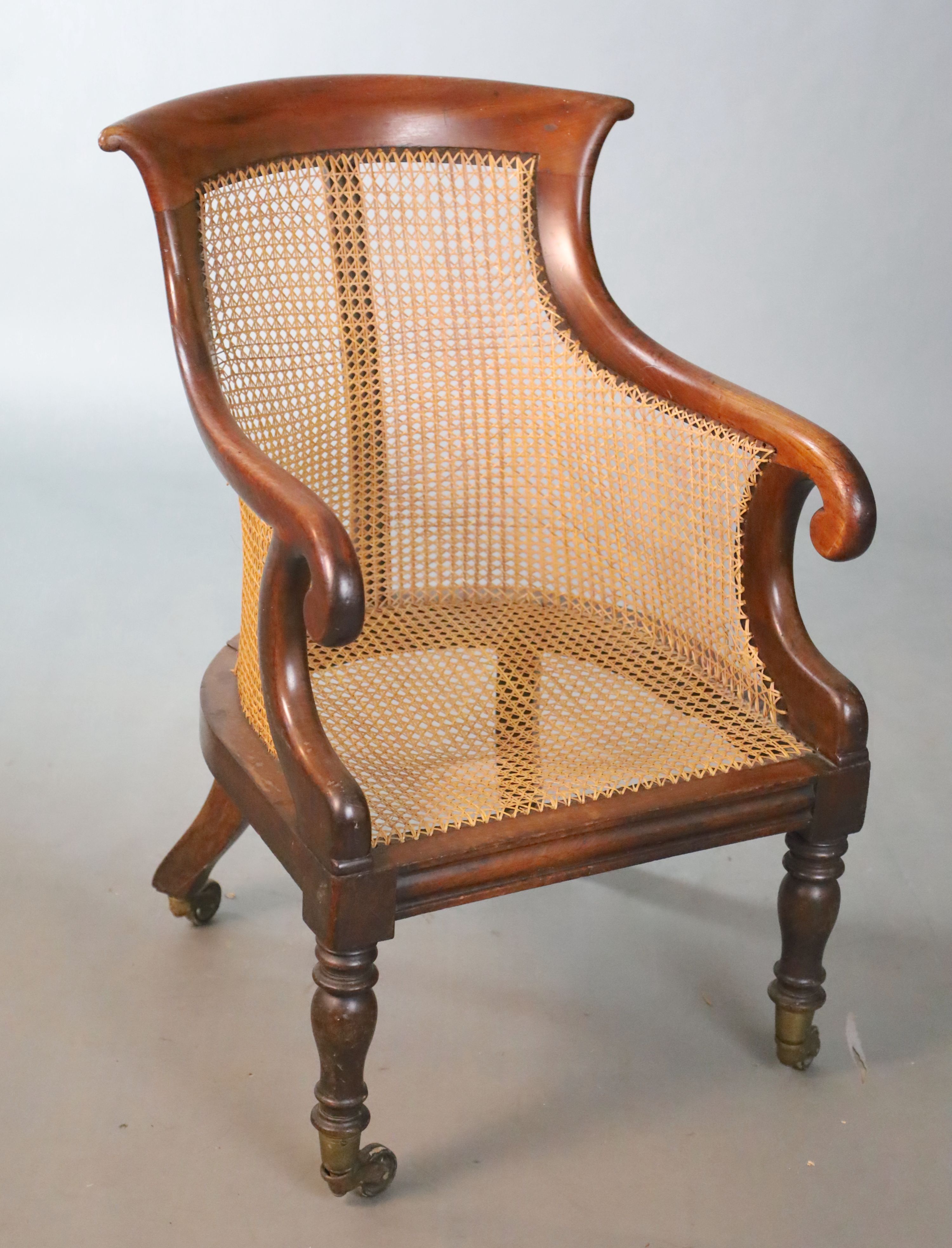 A Regency mahogany bergere armchair, W.58.5cm D.66cm H.89cm